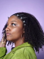 Model Règan wearing a wash-and-go, shaking her hair after using Soft Rows Supreme Strength Deep Conditioning Mask